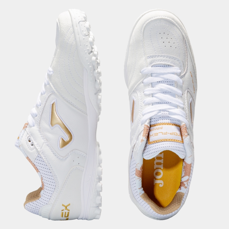 white and gold turf shoes